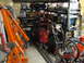 1993 Ford F-250 - Storage area filled with tools, equipment, and bicycles, including an orange engine hoist.
