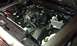 2007 Ford Crown Victoria - The engine bay of a vehicle, the V8 engine, air intake system, and battery components.