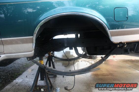 1996 Ford Bronco rear leaf spring suspension removed and vehicle supported by jack stands