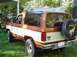 1984 Ford Bronco II - This 1984 Ford Bronco II is shown in a three-quarter rear view, parked on a grassy lawn.