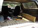 1986 Ford Bronco - The interior of a 1986 Ford Bronco, equipped with tools and lumber in the cargo area.