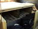 1986 Ford Bronco - Custom wooden platform and subwoofer installed in the bed of a truck.