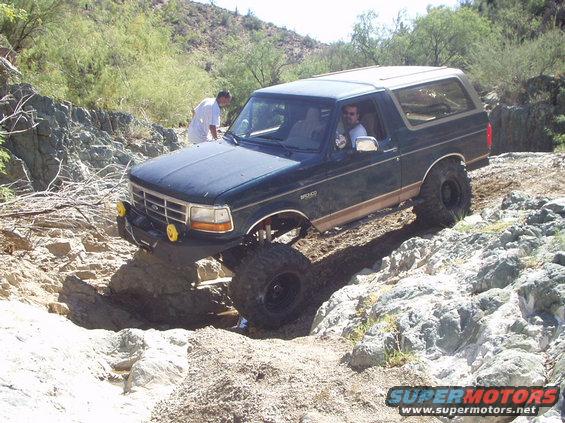 1993 Ford Bronco navigating a rocky off-road trail