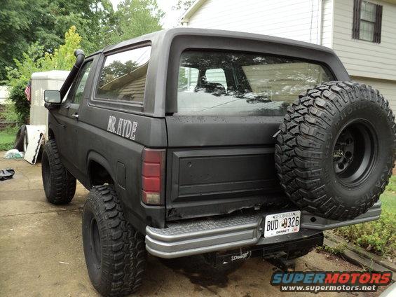 Black SUV with snorkel and spare tire, "MR. HYDE" text on side