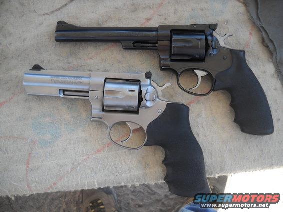 Two revolvers, one stainless steel and one black, are shown side-by-side