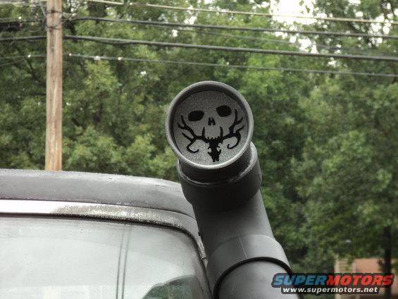 Black snorkel intake with skull and antlers decal on a dark vehicle