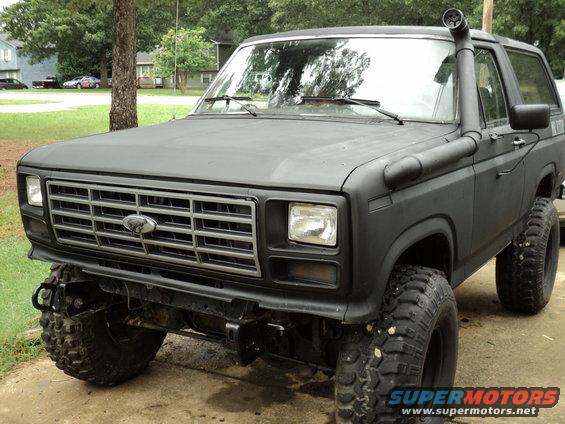 Black Ford Bronco with snorkel, lifted suspension, and off-road tires