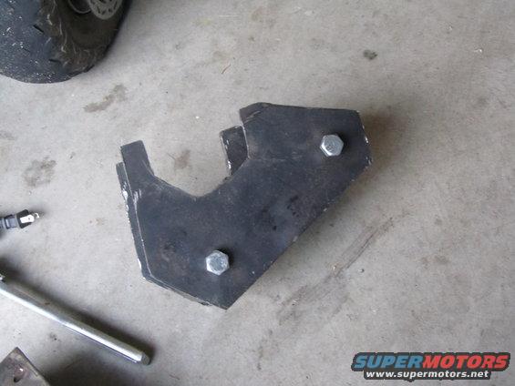 Metal bracket with two bolts, part of a Supermotors.net component