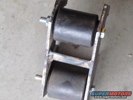 Custom roller assembly with two black rubber rollers mounted on metal brackets