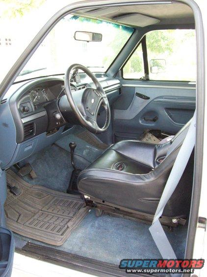 1993 Ford F-150 interior showing driver's seat, dashboard, steering wheel, and floor mats