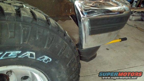 1995 Ford F-150 tire and chrome bumper with black trim