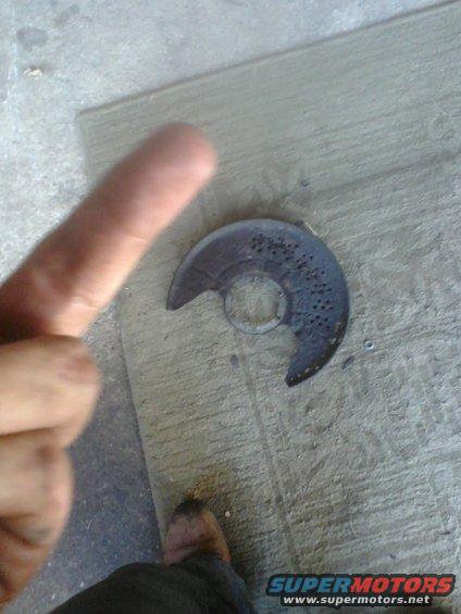 Brake dust shield with perforations