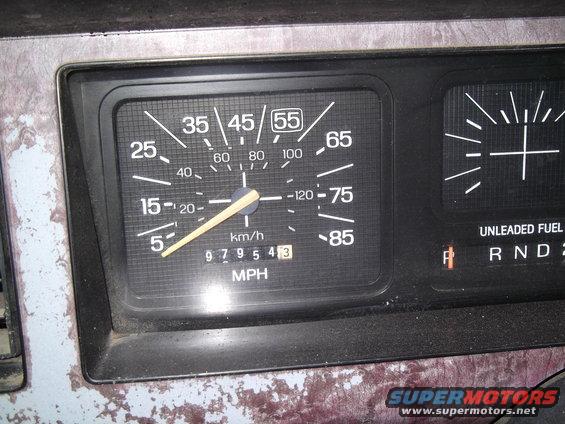 Dashboard gauges with a speedometer reading 55 MPH and an odometer showing 97954.3 miles