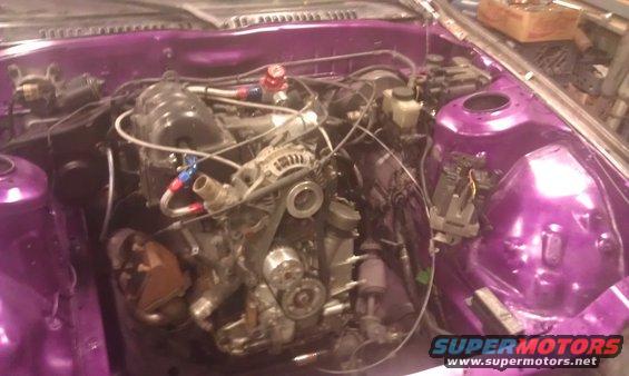 purple engine bay with engine components and wiring