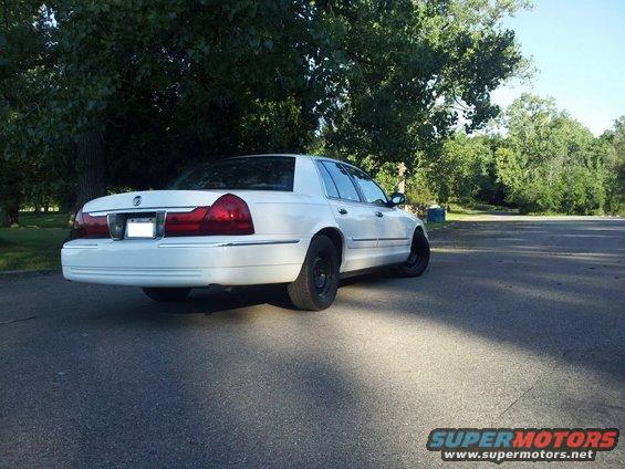 White 2000 Mercury Grand Marquis parked on asphalt, rear view