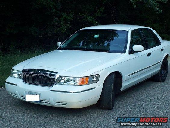 White 2000 Mercury Grand Marquis front 3/4 view with chrome grille