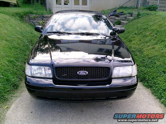 Black 2004 Ford Crown Victoria front view with honeycomb grille