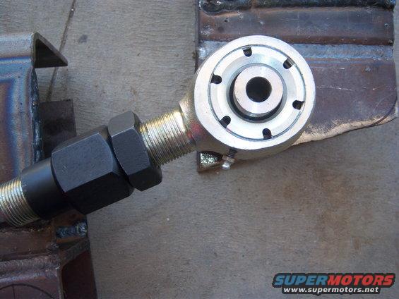 Adjustable suspension component with threaded rod and hex nut clamped in vise