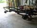 1992 Ford Bronco - The chassis and suspension components of a vehicle are displayed in a workshop setting.