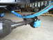1992 Ford Bronco - The rear axle assembly features new blue leaf springs and brake calipers, suggesting recent maintenance or upgrades.