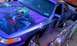 1995 Ford Crown Victoria - This 1995 Ford Crown Victoria features custom airbrushed artwork of the Joker on its purple exterior.
