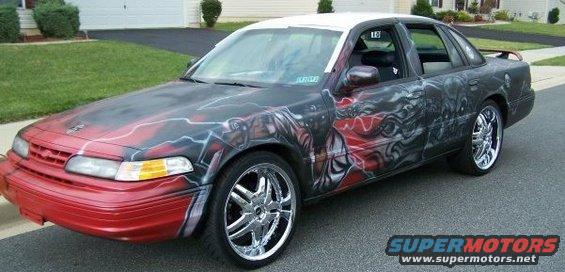1995 Ford Crown Victoria with custom airbrush art on hood and sides, chrome wheels