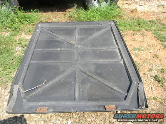 Underside of black tonneau cover with reinforced grid pattern
