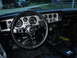 1976 Pontiac Trans Am - Interior view of a 1976 Pontiac Trans Am, an aftermarket steering wheel and a diamond-patterned dash.