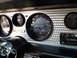 1976 Pontiac Trans Am - Close-up of a car's interior dashboard, highlighting the speedometer and other gauges.