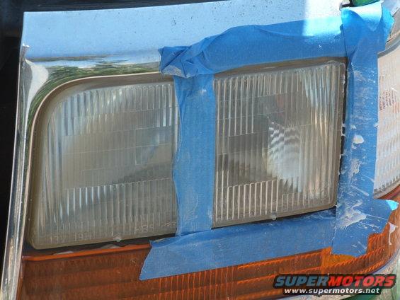 1995 Ford Bronco front headlights taped off for painting