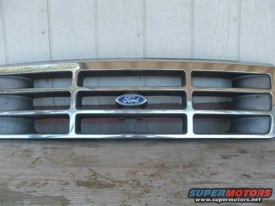 Ford emblem on a chrome grille with horizontal bars