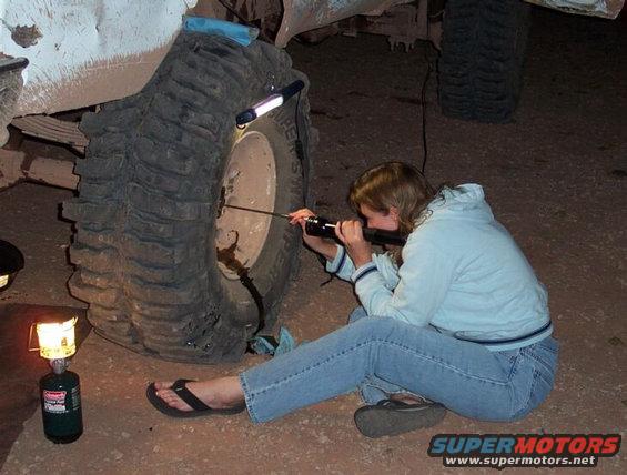 mbg-097.jpg Once again proving that I have the coolest gf in the world, Tanya happily fishes out broken pieces from Daves SECOND rear 60 shaft break (note this made three total rear 60 shafts destroyed on this trip between Mike and Dave).