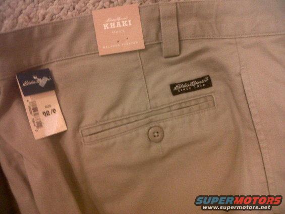 Khaki pants with Eddie Bauer tags and a rear pocket button