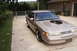1993 Ford Crown Victoria - This modified 1993 Ford Crown Victoria features a prominent engine cutout in its hood, revealing the supercharged powerplant.