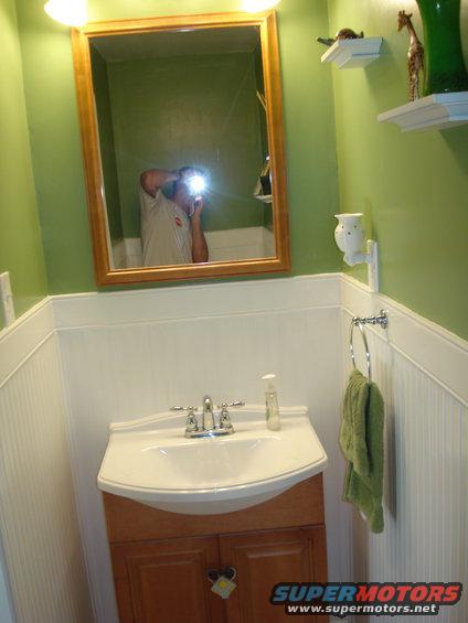 walls are covered with 1/4" plywood waynescoting.  its not the high dollar stuff, but a huge step up from the mdf crap a lot of guys use.