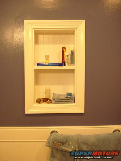 008.jpg this is a little recessed shelf i built using the waynescoting for backer and regular door casing for the trim/framing