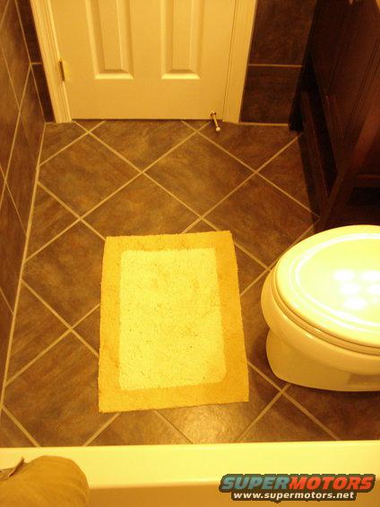 floor tile on a diagonal.  creates a little more waste but adds a nice touch
