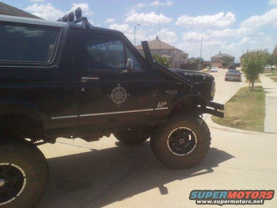 Black lifted SUV with snorkel and compass decal on the side