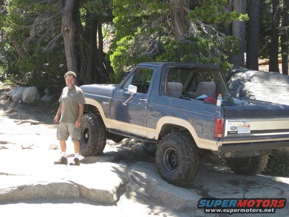 1986 Ford Bronco 3q-front view, blue and tan, off-roading
