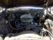 1979 Ford Ranchero - View of the engine bay, a V8 engine and a prominent air cleaner assembly.