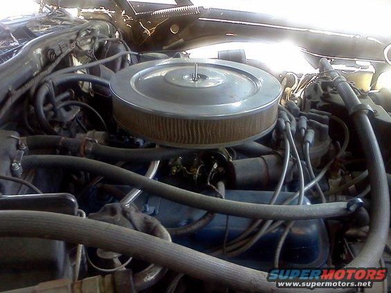 Engine bay detail showing air cleaner assembly and wiring