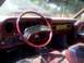 1979 Ford Ranchero - Interior view of a 1977 Ford Thunderbird, with wood grain accents and red upholstery visible.