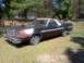 1979 Ford Ranchero - This 1977 Ford Ranchero is parked outside with a stacked wood wall in the background.