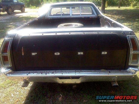 1979 Ford Ranchero rear, spare tire in bed. Another truck is visible in background