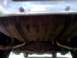 1979 Ford Ranchero - The underside of a vehicle shows the fuel tank, rear differential, and exhaust system.