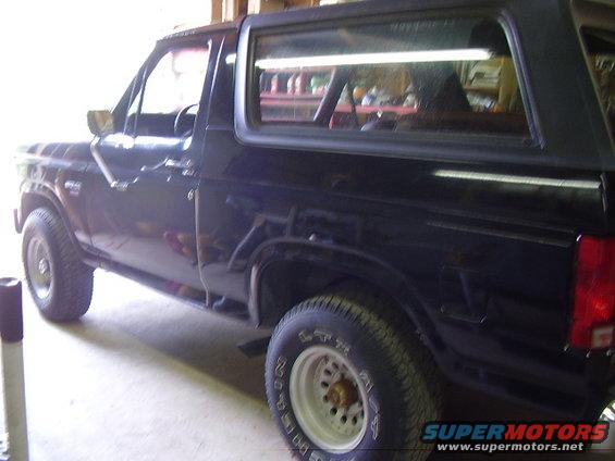Black Ford Bronco parked inside a garage