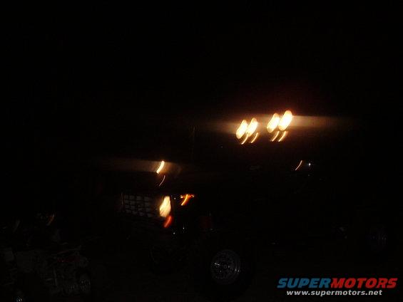 Truck front with roof lights illuminated at night