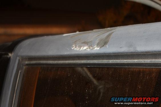 Damaged roofline above window on vehicle
