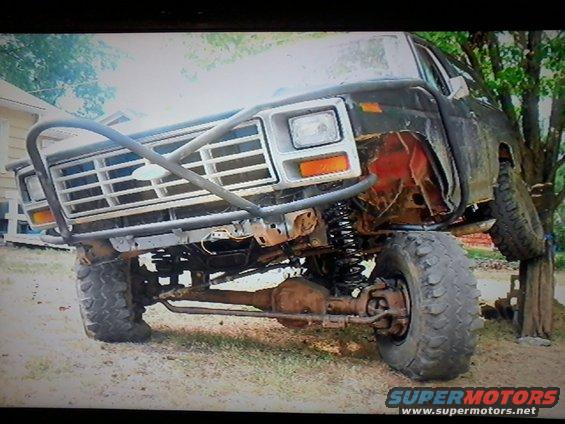 Off-road modified truck with custom bumper and lifted suspension