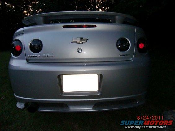 Rear view of a silver 2009 Chevrolet Cobalt SS with tinted taillights and a spoiler